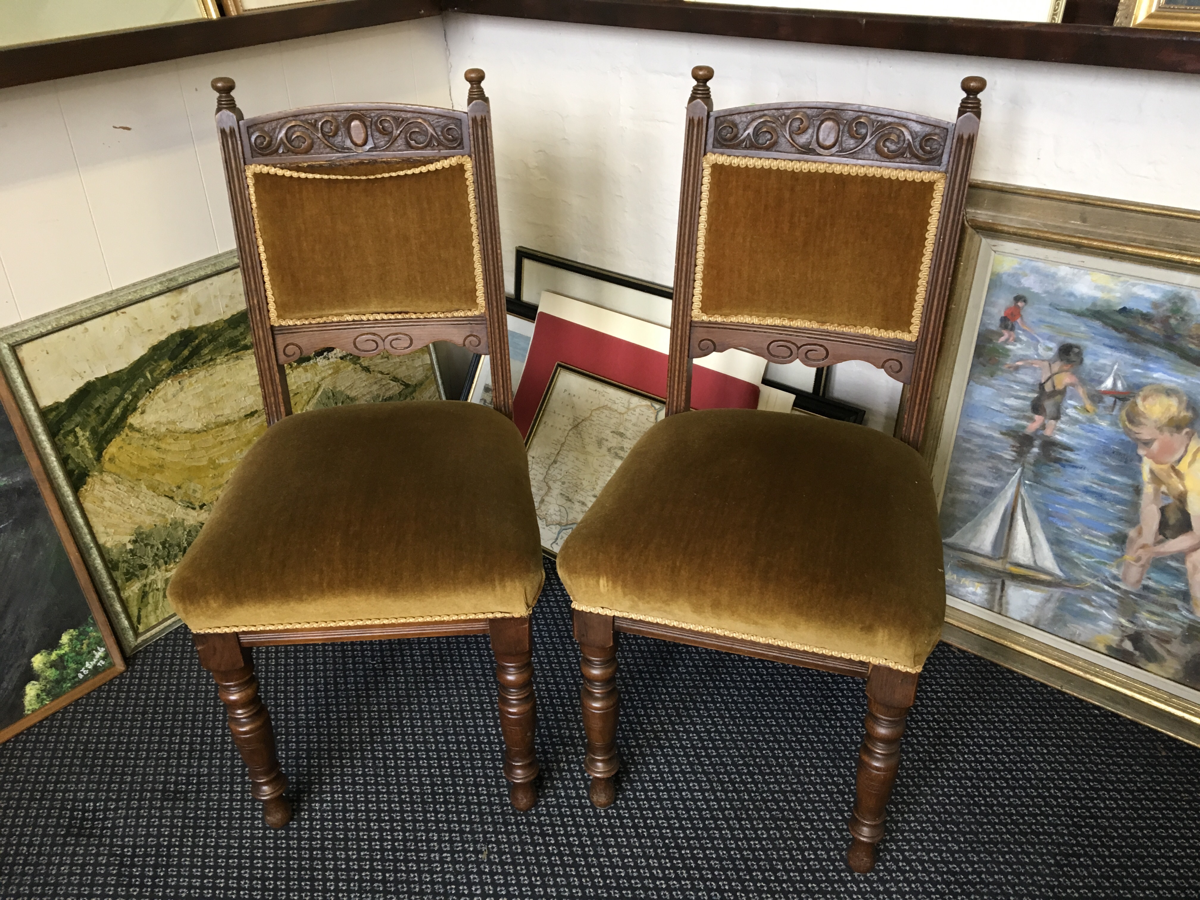 Six Edwardian oak dining chairs.