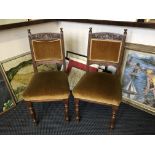Six Edwardian oak dining chairs.