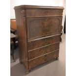 A walnut secretaire Biedermeier desk fitted with four drawers and interior. Height- 144cm, Width-