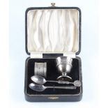 A boxed part Christening set, comprising a silver egg cup and napkin ring, both hallmarked