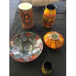 A selection of Poole pottery to include a small vase and bowls.