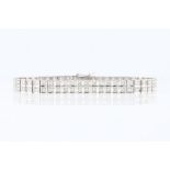 A two row diamond bracelet, set with ninety-two round brilliant cut diamonds in square articulated