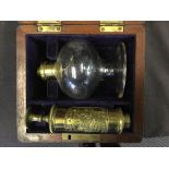 A Salt and Son Victorian brass breast pump manufactured in Birmingham in mahogany box with purple