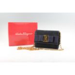 A Salvatore Ferragamo bow bag with chain strap, housed in box.