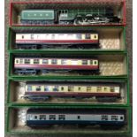 Four Hornby Rolling Stock carriages together with a Hornby Flying Scotsman 00 gauge train.