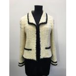 A CHANEL cream and black woven jacket size 40.