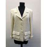 A CHANEL Boutique cream button up jacket