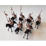 Twenty-one Britains Toy Soldiers cavalry lancers on black horses.