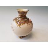 A Royal Worcester small bulbous vase painted with pink flowers and gilded borders, puce mark to base