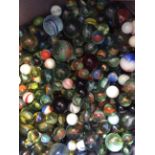 A bag containing a quantity of various coloured glass marbles