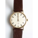 A 9ct yellow gold gents Shield wrist watch, the silver-tone dial having hourly baton markers and