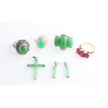 WITHDRAWN. A collection of Oriental green hardstone jewellery, to include a three cabochon open