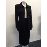 A CHANEL Boutique black woven blazer together with matching skirt.