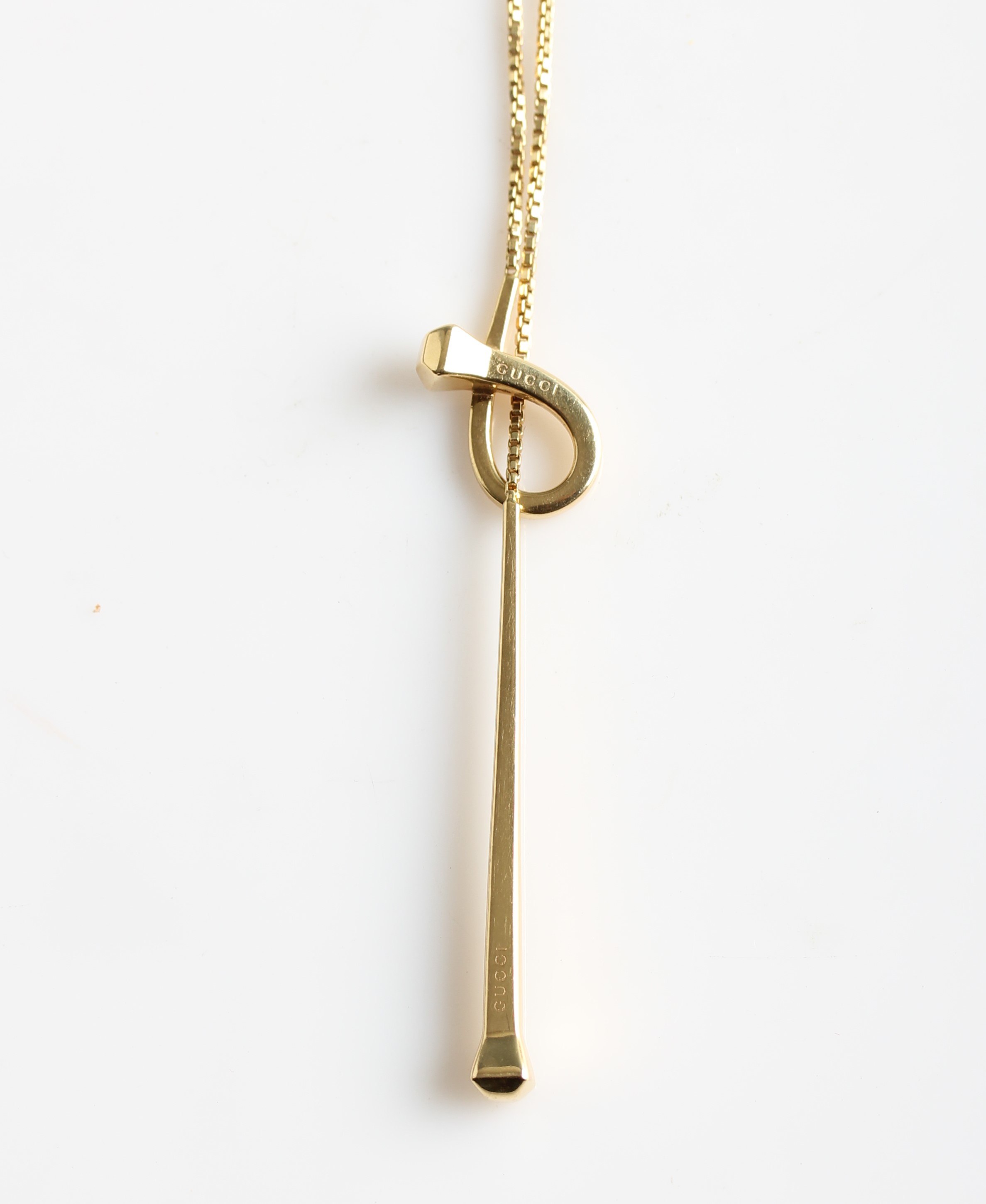 A hallmarked 18ct yellow gold Gucci necklet, the tapered bar and loop design stamped GUCCI, housed - Image 2 of 2