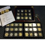 Three trays of silver coins from the The Millionaires Collection in mahogany box with folder of
