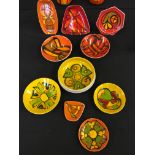 A selection of orange and yellow painted Poole pottery to include small bowls and a selection of