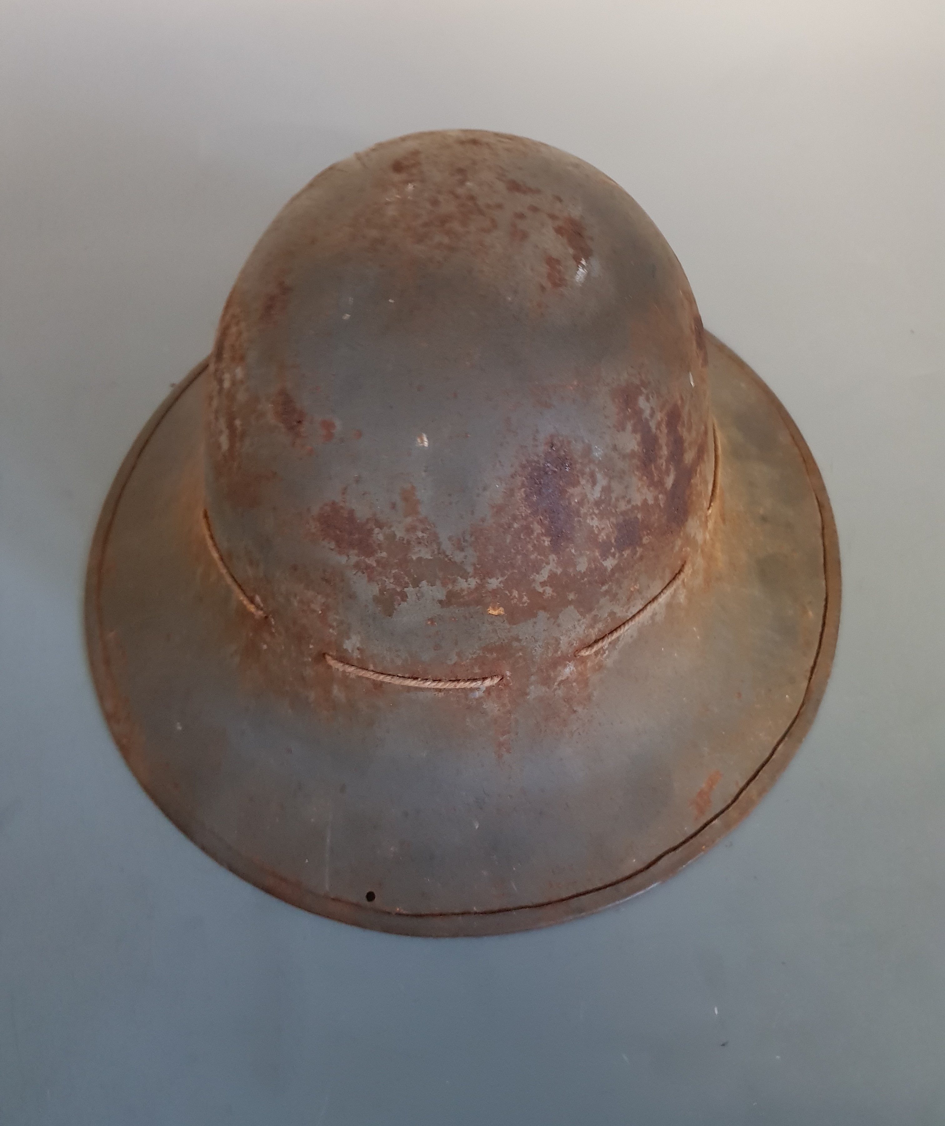 A WW1 grey painted helmet.