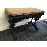 A turn of the Century heavily carved oak leaf oak single drawer side table with two turned bulbous