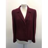 A CHANEL Boutique ladies burgundy blazer with silk lining size 40.