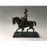 A modern bronze of Napoleon riding a cantering horse on green marble base, total height 28cm.