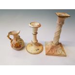 A Royal Worcester candlestick holder with column and swag design to base, puce mark to base dated