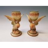 A pair of Royal Worcester restored potpourri holders, with bird design and pierced egg shaped