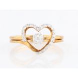 A hallmarked 9ct yellow gold diamond two ring set, one ring in heart open metalwork diamond set