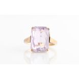 A hallmarked 9ct yellow gold amethyst dress ring, set with a princess cut amethyst, measuring