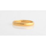 *A 22ct yellow gold wedding band.