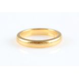 A hallmarked 22ct yellow gold wedding band, ring size K½.