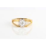 A hallmarked 18ct yellow gold diamond solitaire ring, set with a round brilliant cut diamond,