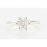 A diamond flower design cluster ring, set with round brilliant cut diamonds, hand engraved 18k, ring