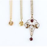 Two diamond set flower design pendants, one stamped 10k on a hallmarked 9ct yellow gold chain, the