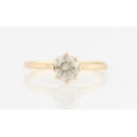 A hallmarked 9ct yellow gold diamond solitaire ring, set with a round brilliant cut diamond,