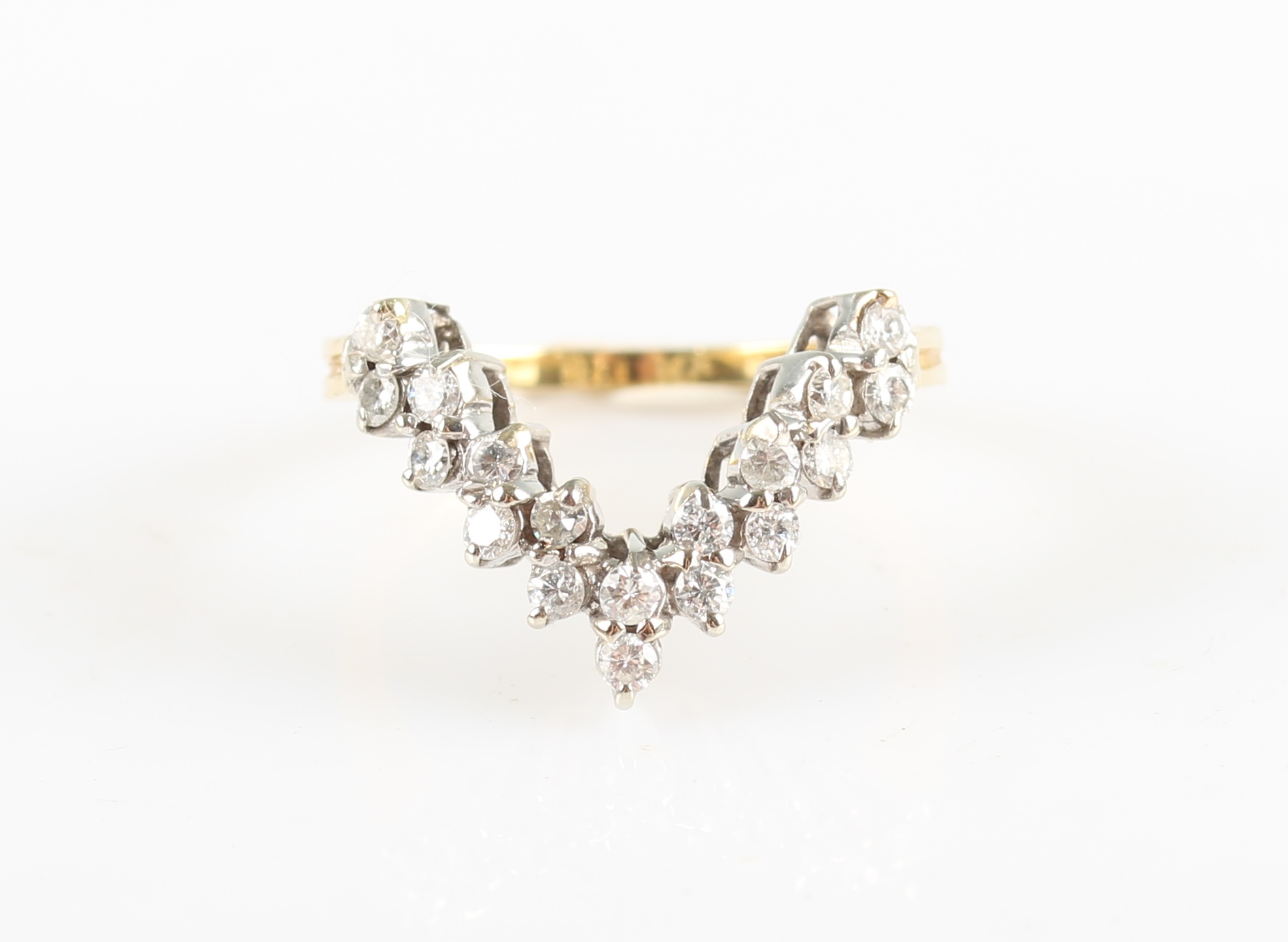 A diamond wishbone design ring, set with eighteen round brilliant cut diamonds, total diamond weight