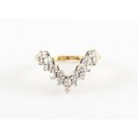 A diamond wishbone design ring, set with eighteen round brilliant cut diamonds, total diamond weight