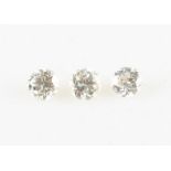 A collection of three loose diamonds to include, two round brilliant cut diamonds, each measuring