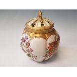 A Royal Worcester melon shaped vase with pieced lid and floral design. Puce mark to base dated 1889,