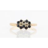 A hallmarked 9ct sapphire and diamond double cluster ring, ring size O.