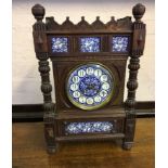 An L. Marti et Cie oak cased clock with raised gallery top, turned and fluted columns and blue and