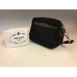 A PRADA Milano black fabric bag with leather straps and PRADA cloth bag