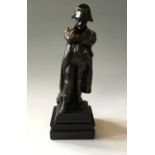 A cast metal figure of Napoleon with arms crossed on cast metal base, total height 31cm.