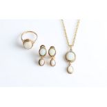 A suite of opal jewellery, comprising a pair of drop clip-on earrings, stamped 375, a hallmarked 9ct