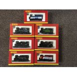Seven Hornby 00 Gauge industrial locomotive with a quantity of track.