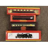 A Hornby 00 Gauge together with three Hornby rolling stock carriages to include Sleeping Car.