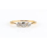 A three stone diamond ring, set with three graduated round brilliant cut diamonds, total diamond