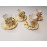 A set of four Royal Worcester cups and saucers with floral design. Puce mark to base.