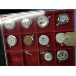 A selection of ten replica pocket watches with various different designs in Linder display tray