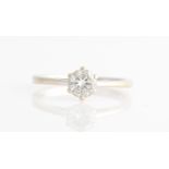 A hallmarked 18ct white gold diamond solitaire ring, set with a round brilliant cut diamond,