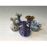 A group of five glass millefiori small vases of various different colours.
